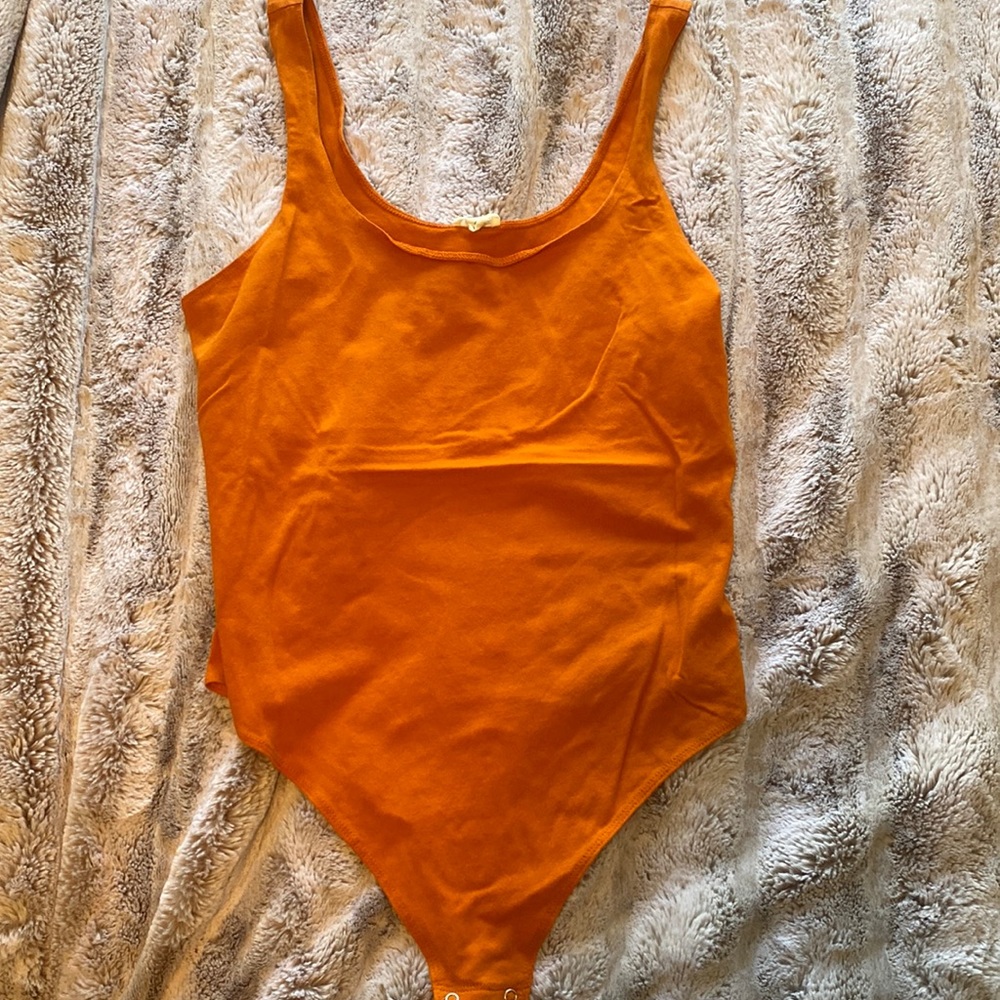 Orange GARAGE brand bodysuit